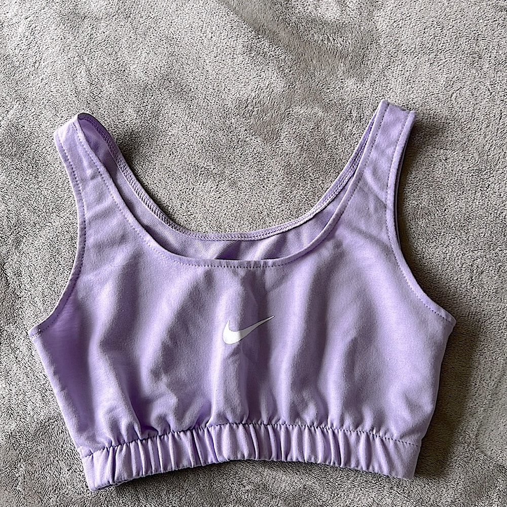 Size Small, purple Nike Crop top. In good condition, worn once or twice.